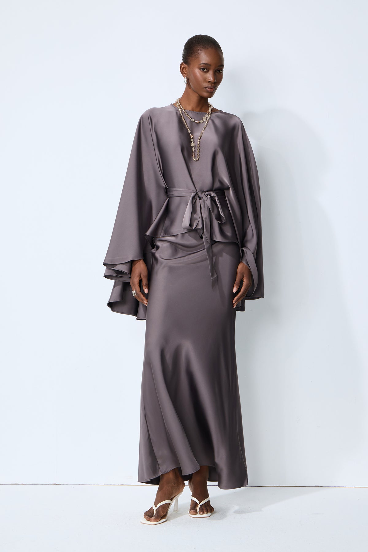 Exceptionally Graceful Grey Satin Cape Sleeve Top & Skirt Set