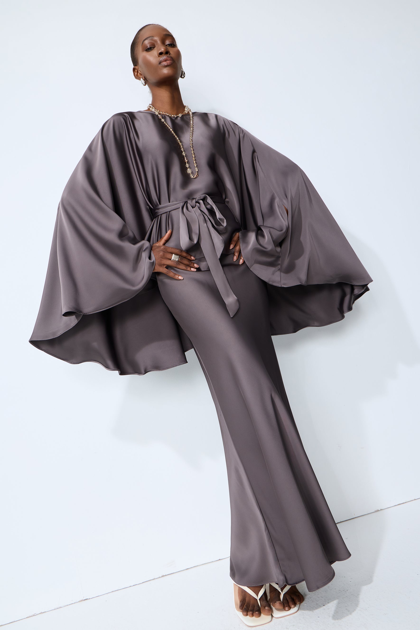 Exceptionally Graceful Grey Satin Cape Sleeve Top & Skirt Set